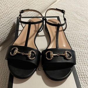 Authentic black Gucci sandals with gold hardware